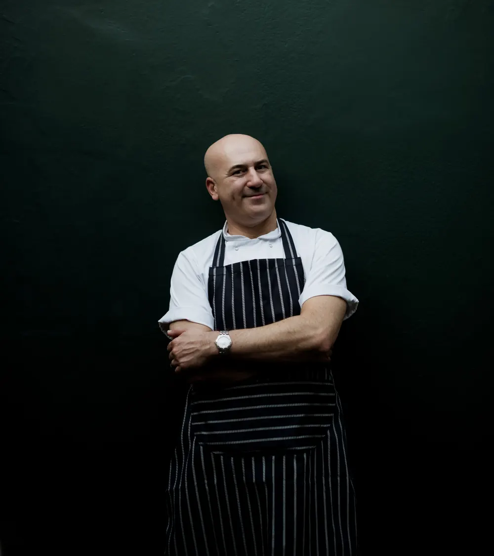 Chef Patron Alex Grahame in a striped apron